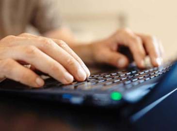 Typing on a laptop keyboard