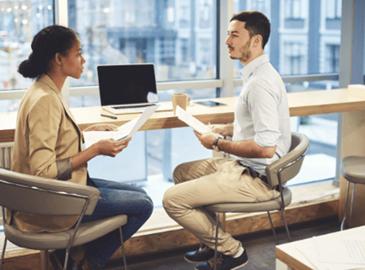 A man asking a woman questions 