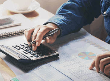 Man using a calculator at desk