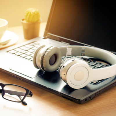 Headphones on a laptop on desk