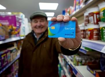A customer holding a British Gas Card
