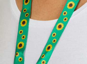 A green lanyard with sunflowers 