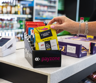 A customer selects a new sim card from a countertop display
