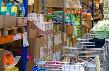 A retail stockroom with stock organised in aisles